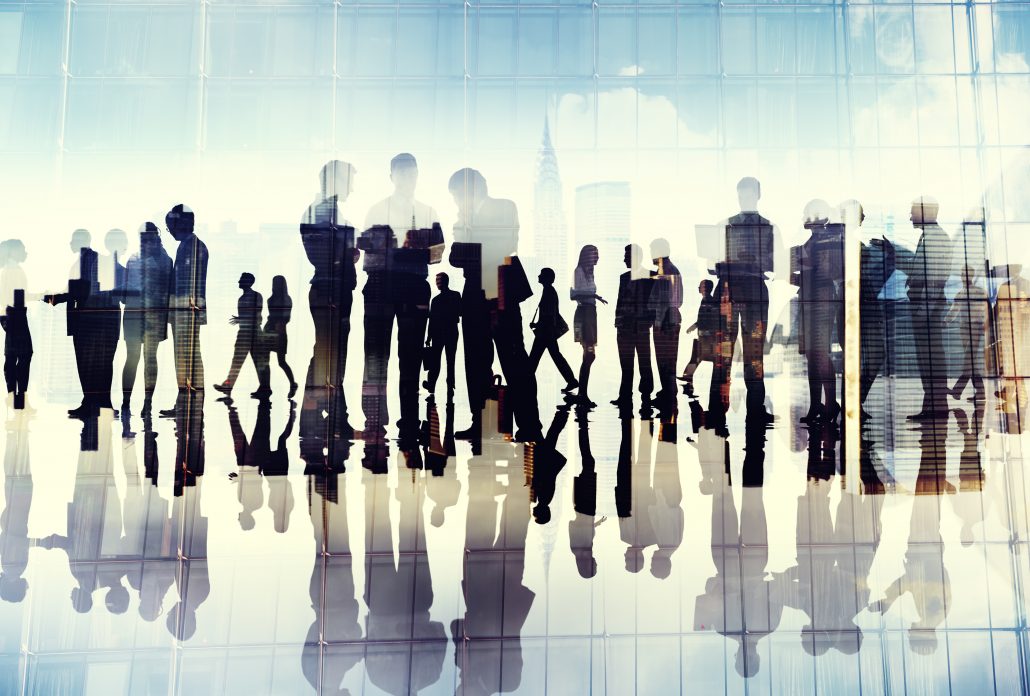 Silhouettes of business people working in an office